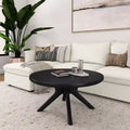 Table basse ronde à pieds croisés en bois massif