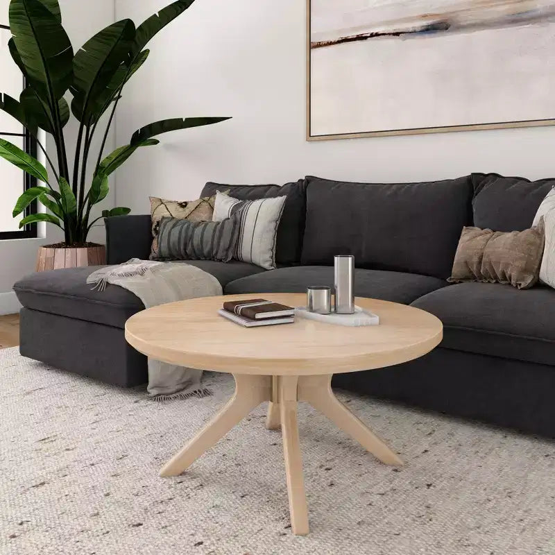 Table basse ronde à pieds croisés en bois massif