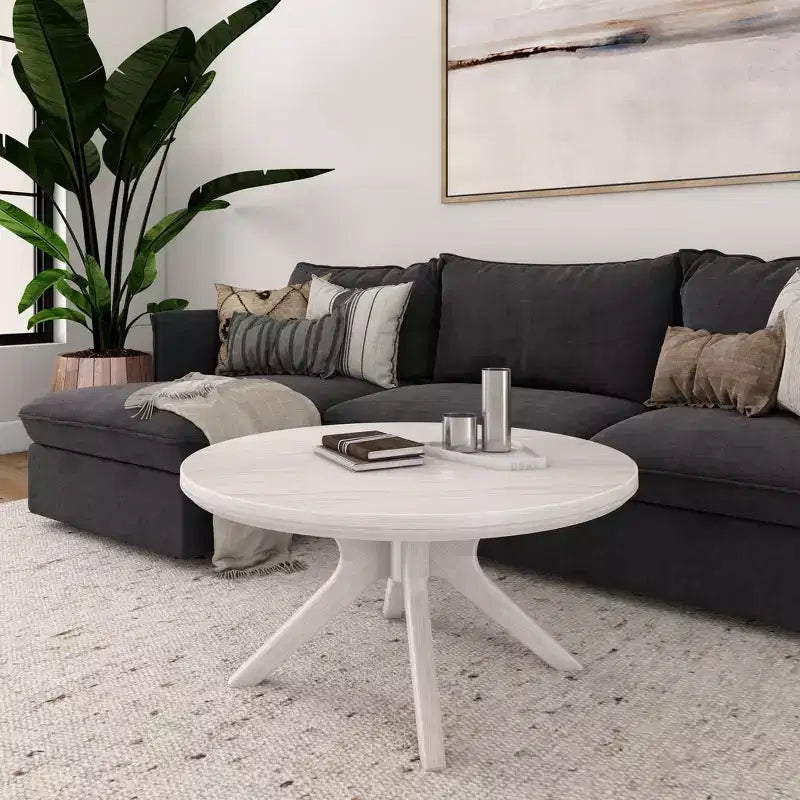 Table basse ronde à pieds croisés en bois massif
